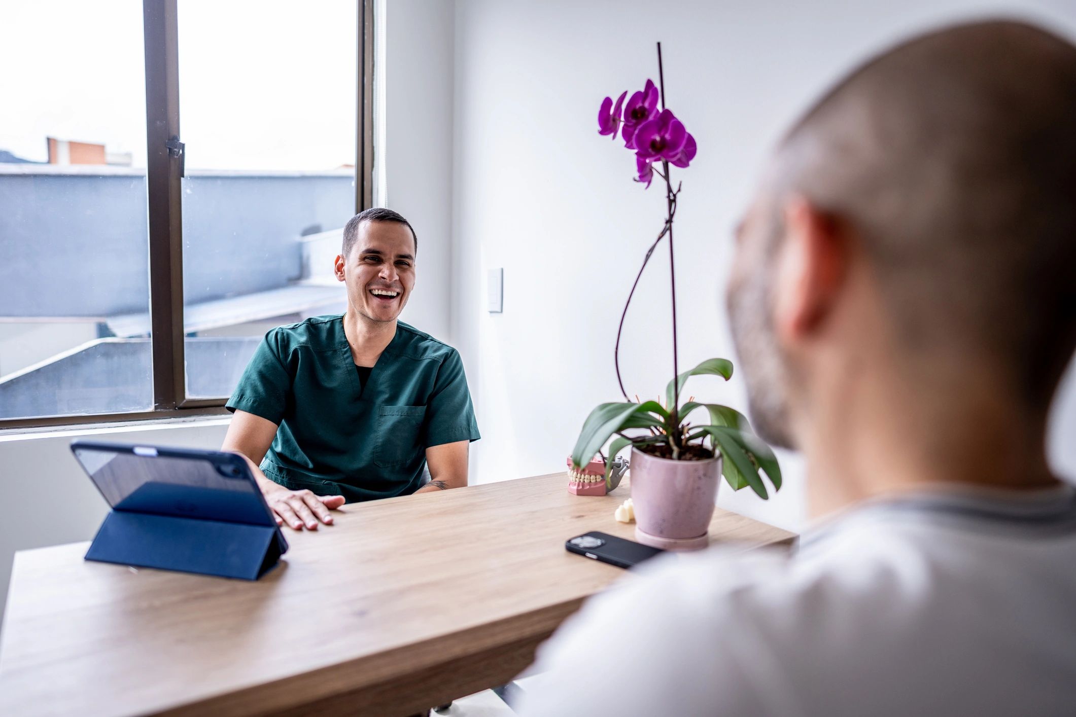 Doctor speaking with a patient in a clinic setting
