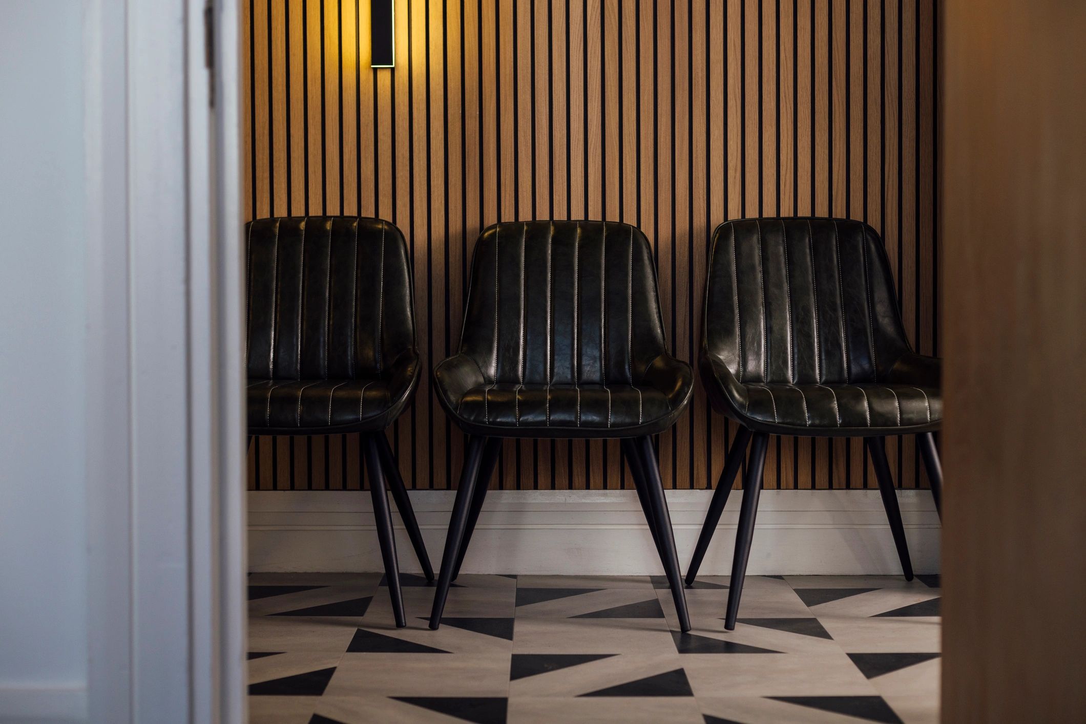Smiling patient portrait in a bright waiting area